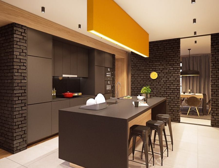 On se sent tout de suite enveloppé dans une ambiance chaleureuse en regardant cette fois. Le choix de la couleur chocolat dans la cuisine est plutôt originale. Mais le résultat est là. On a une jolie cuisine de style loft.