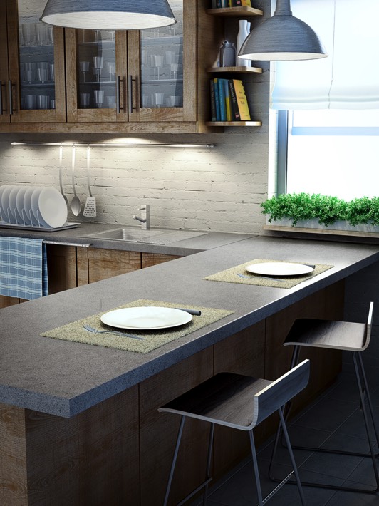 Cuisine gris clair avec plan de travail en L avec évier en céramique intégré et robinet mélangeur. Rangements en bois en hauteur et lampes suspendues.
