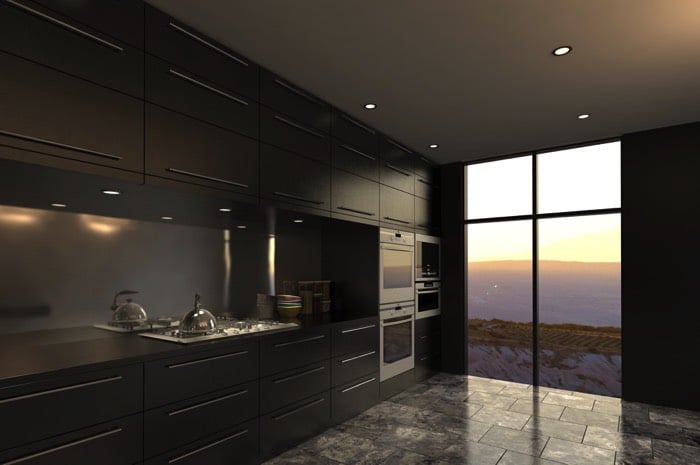 Cuisine en gris anthracite avec plan de travail en I et plaque de cuisson intégré. Multitude de rangements en haut et en-dessus et carrelage avec ouverture vitrée.